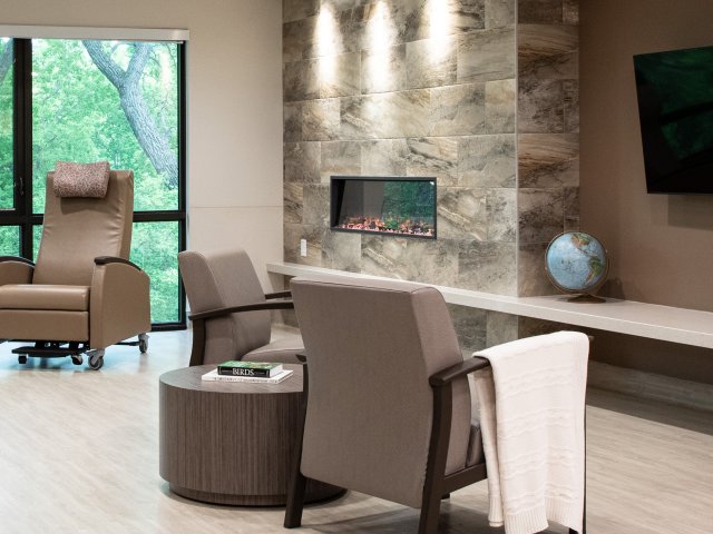 Boyne Lodge Household Common Area featuring fireplace and television